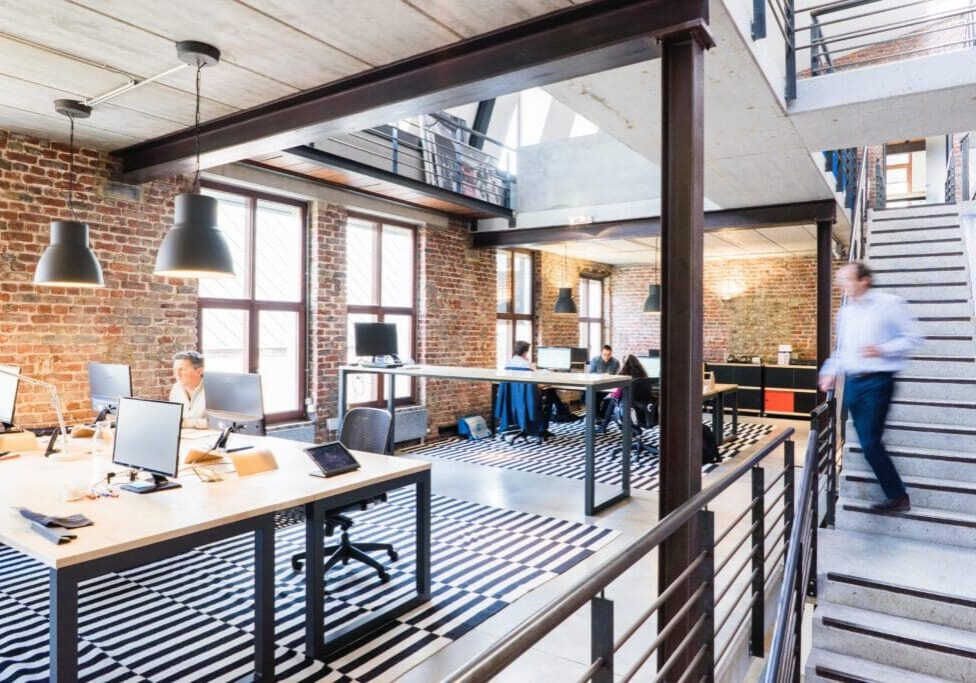 A room with many tables and chairs in it